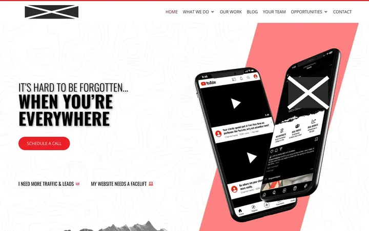 Firm J home page on a laptop, with names, logos, phone numbers and faces covered